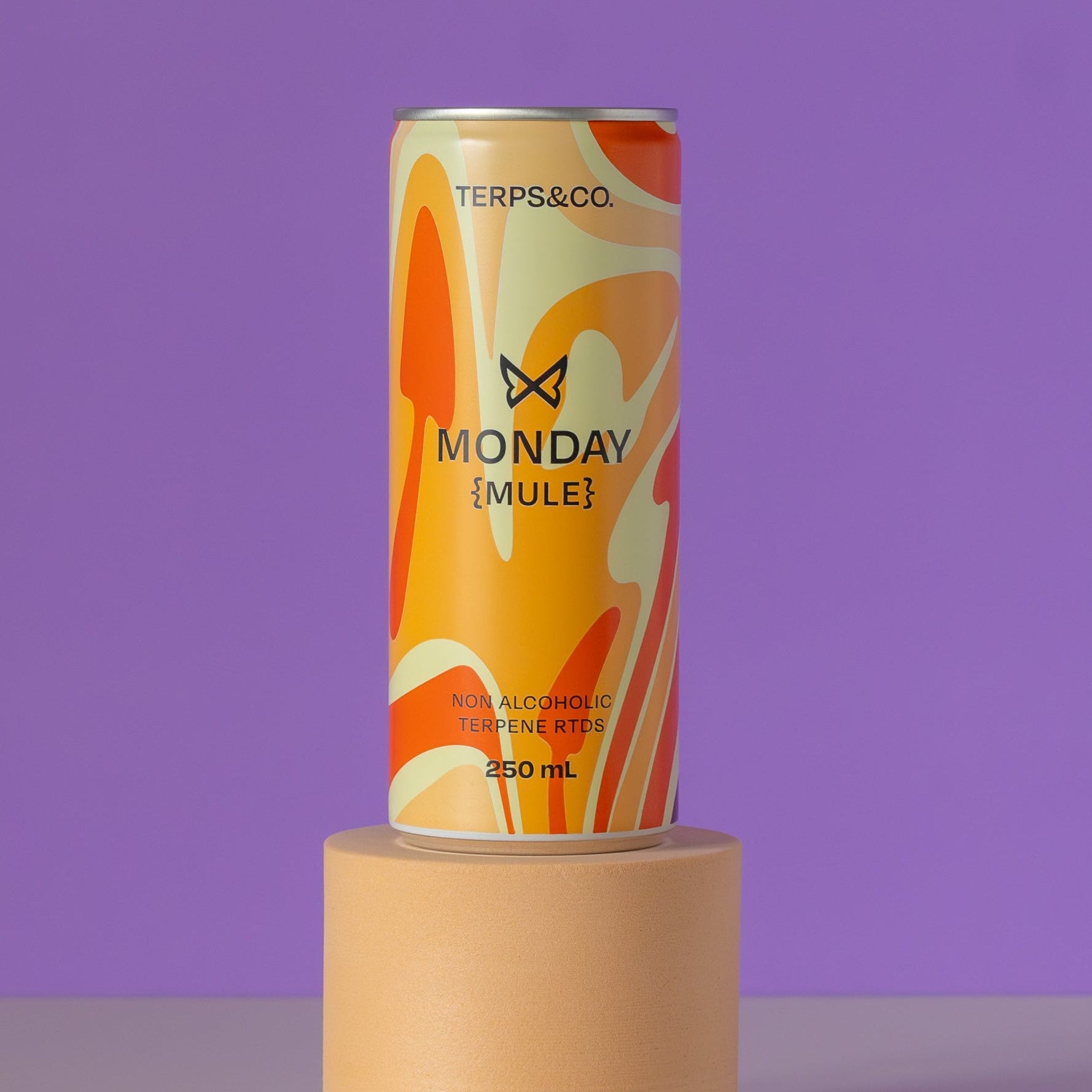 Can of 'Monday Mule' non-alcoholic beverage on a purple background